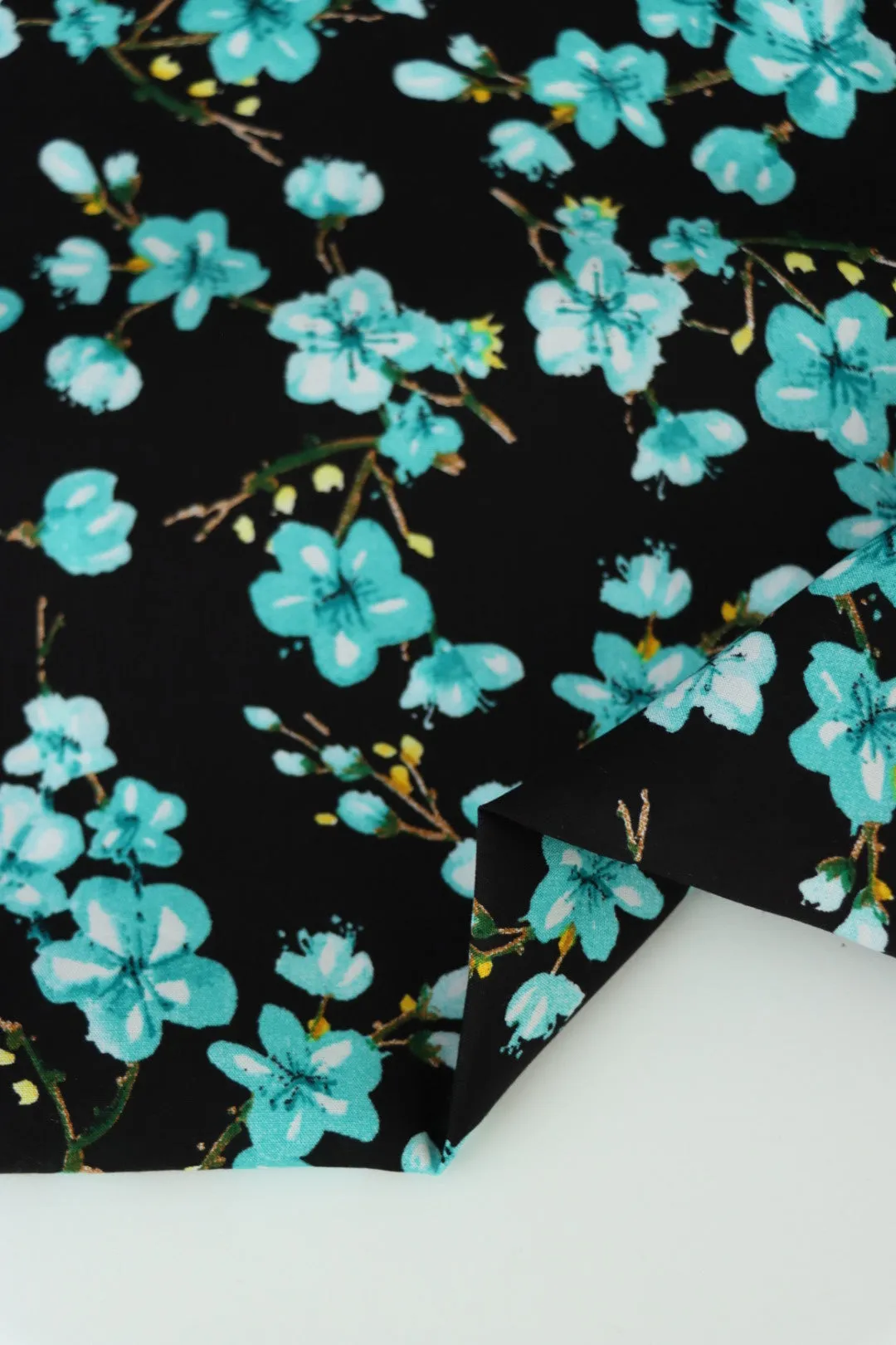 4YD 21IN REMNANT; Aqua Plumerias on Black Rayon Challis